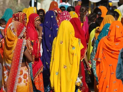 Women in brightly coloured saris in India